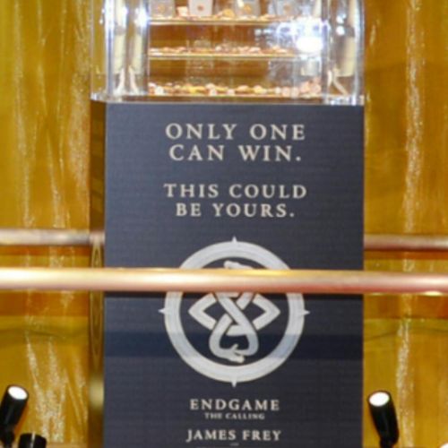 A bottle of perfume on display in a store.