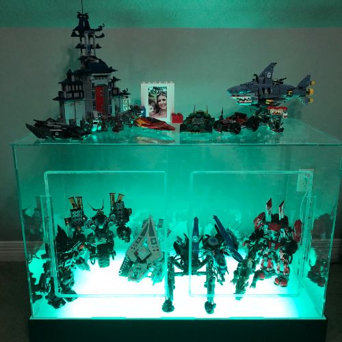 A display case with many different toys on it