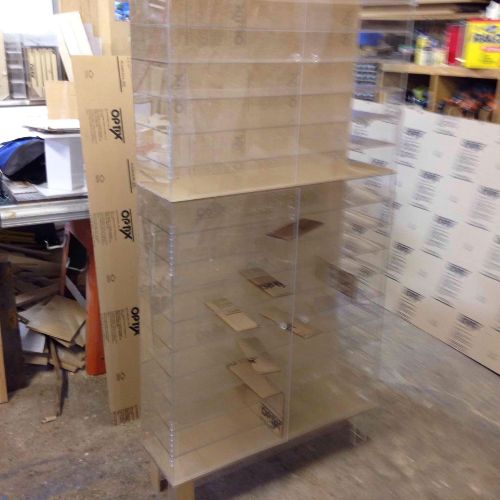 A large stack of boxes in the middle of a room.